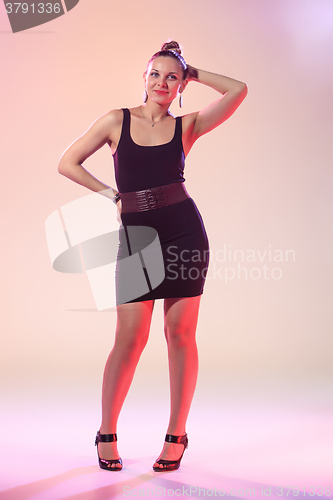 Image of The young cool woman is dancing