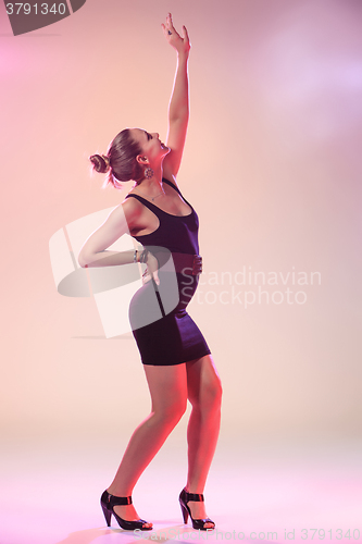 Image of The young cool woman is dancing