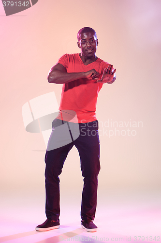 Image of The young cool black man is dancing