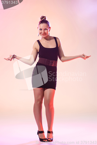 Image of The young cool woman is dancing