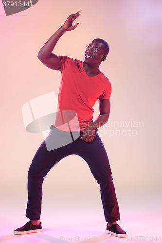 Image of The young cool black man is dancing
