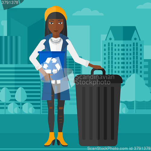 Image of Woman with recycle bins.