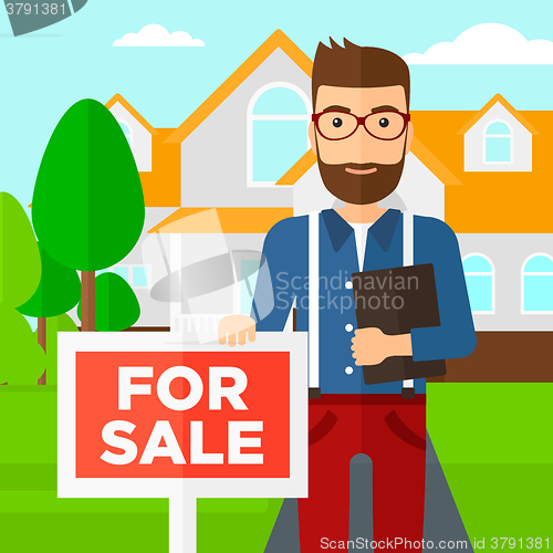 Image of Real estate agent offering house.