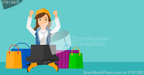 Image of Woman making purchases online.