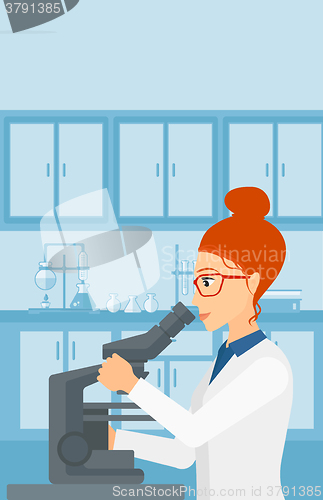 Image of Laboratory assistant with microscope.