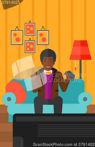 Image of Man playing video game.