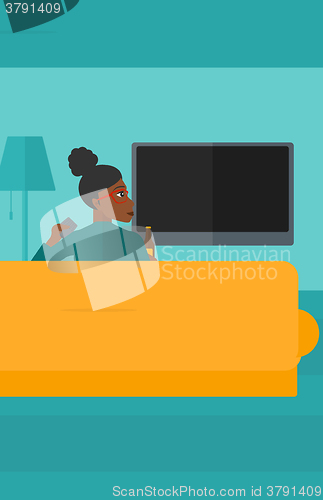 Image of Woman watching TV.