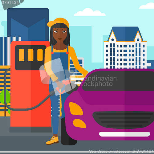 Image of Woman filling up fuel into car.