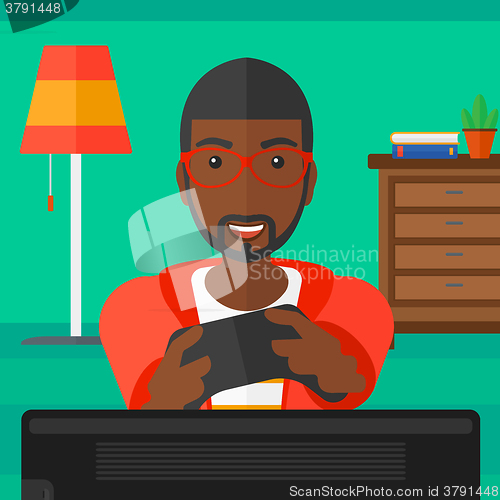 Image of Man playing video game.