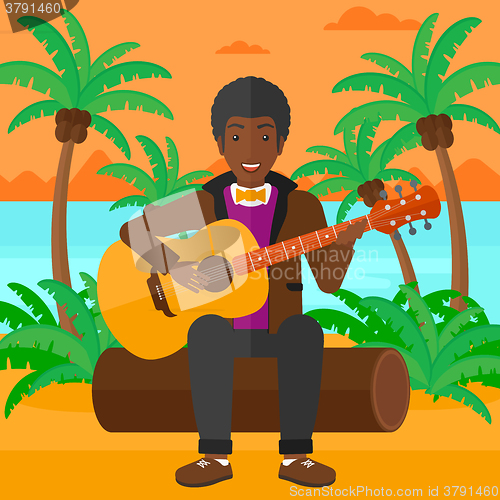 Image of Man playing guitar.