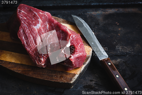 Image of fresh meat beef on dark background