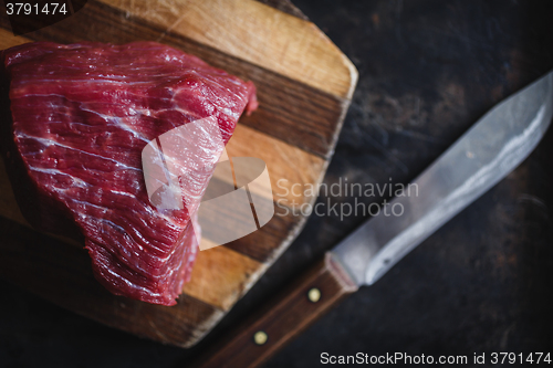 Image of fresh meat beef on dark background