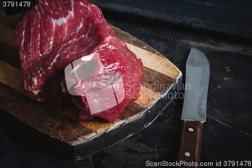 Image of fresh meat beef on dark background