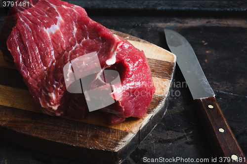 Image of fresh meat beef on dark background