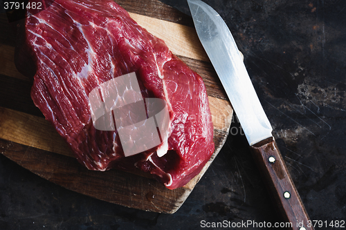 Image of fresh meat beef on dark background