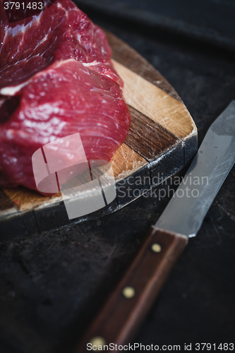 Image of fresh meat beef on dark background