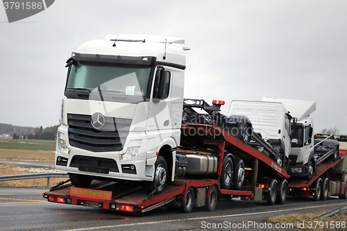 Image of New Mercedes-Benz Trucks Being Hauled