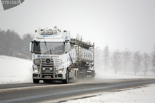 Image of White Mercedes-Benz Actros Truck and Road Salt