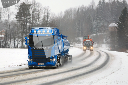 Image of New and Old Scania Trucks on the Road
