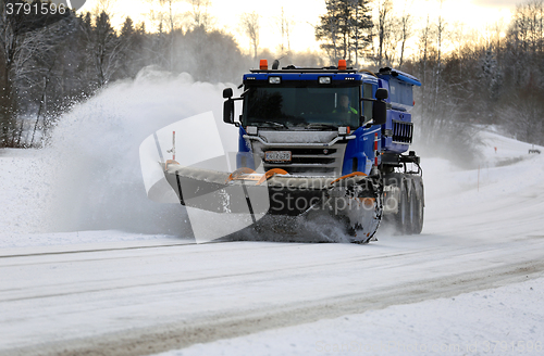 Image of Scania Truck with Snowplow Clears Highway