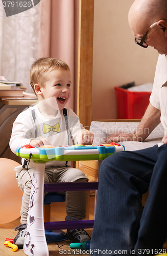 Image of Candid portrait of a beautiful laughing toddler