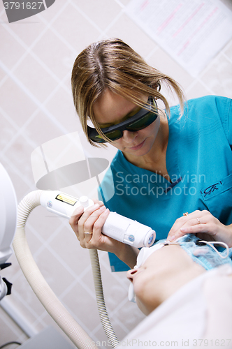 Image of Patient undergoing skin treatment with a laser