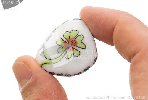 Image of Stone with drawing of a clover four and small hearts