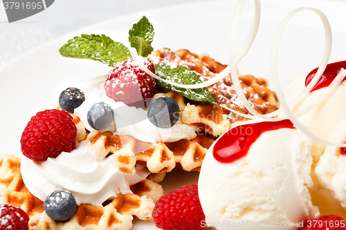 Image of Waffle with vanilla ice cream and fresh berries