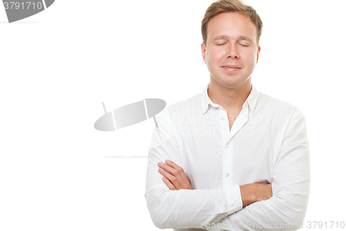 Image of Young man with closed eyes isolated on white