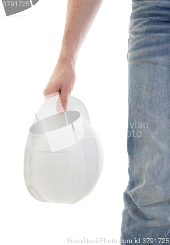 Image of Male engineer in jeans holding white hardhat