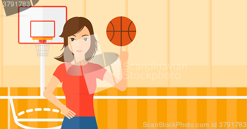 Image of Basketball player spinning ball.