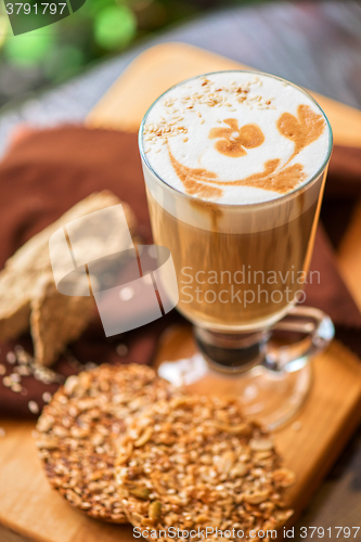 Image of coffee latte cup with cookies