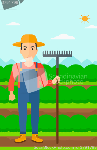 Image of Farmer with rake.