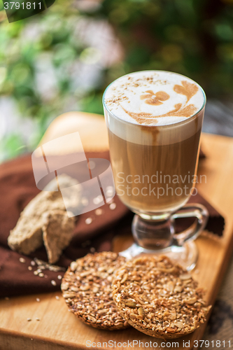 Image of coffee latte cup with cookies