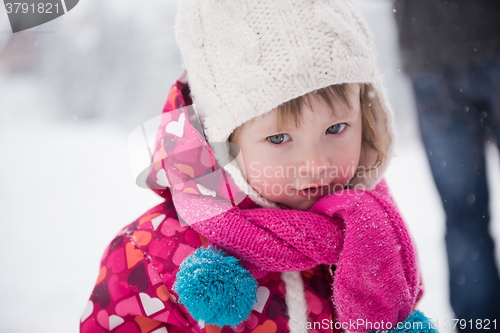 Image of little girl have fun at snowy winter day