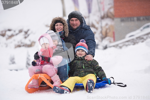 Image of children group  having fun and play together in fresh snow