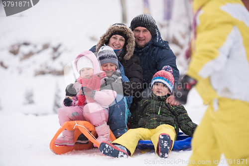 Image of children group  having fun and play together in fresh snow