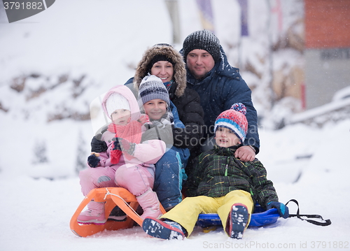 Image of children group  having fun and play together in fresh snow