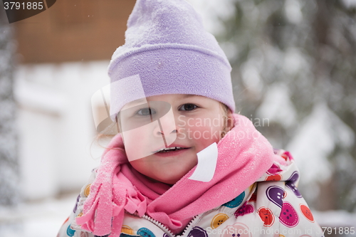 Image of little girl have fun at snowy winter day