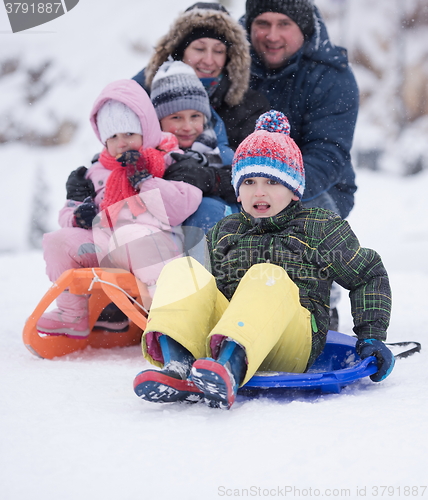 Image of children group  having fun and play together in fresh snow