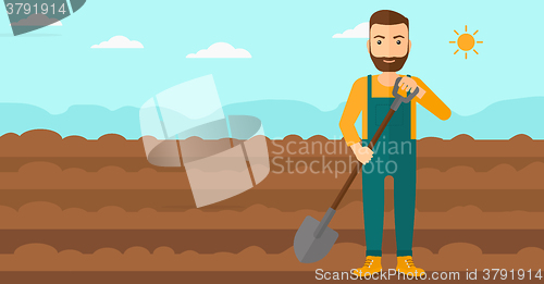 Image of Farmer on the field with shovel.