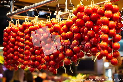 Image of Tomatoes at a stand in the Boqueria Market, in Barcelona, Spain.