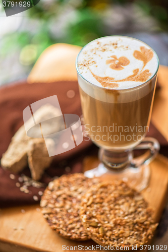 Image of coffee latte cup with cookies