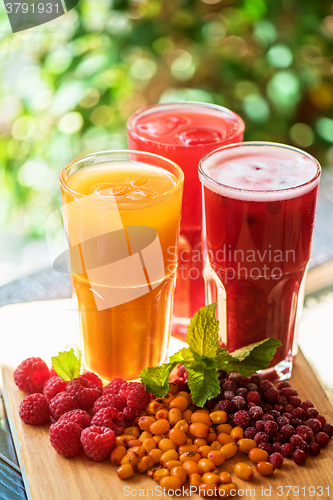 Image of fruit drink with cranberries raspberries and sea buckthorn