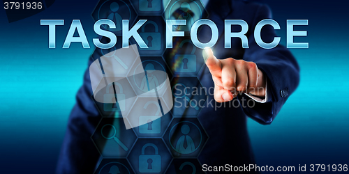 Image of Forensic Expert Pressing TASK FORCE\r