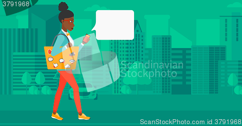 Image of Woman walking with smartphone.