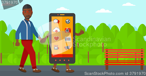 Image of Man walking with smartphone.