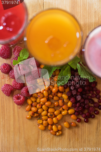 Image of fruit drink with cranberries raspberries and sea buckthorn