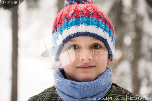 Image of little boy having fun on winter day