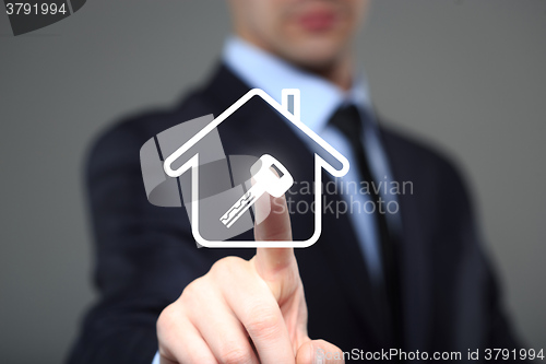 Image of businessman clicks on the icon lodge. key image. The virtual screen